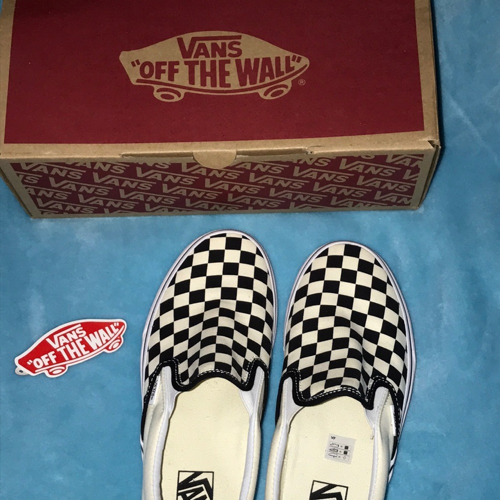 Slip on checkered  black&white Vans.